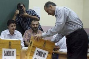 Тайип Эрдоган у избирательного урна