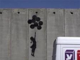 Палестинский рисунок на стене, выстроенной израильтянами