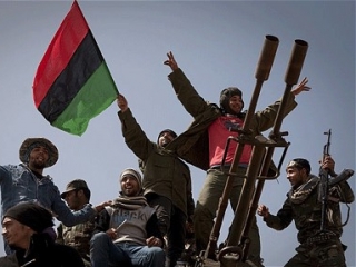 Вопрос финансирования нового телеканала взяли на себя богатые ливийцы, проживающие заграницей (на фото: ливийские повстанцы)