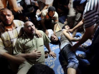 В результате обстрела демонстрации сторонников Мурси в Каире погибли по меньшей мере 34 человека, свыше 300 получили ранения