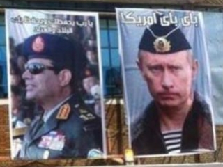 К визиту Лаврова и Шойгу в Каире развесили портреты Сиси и Путина в военной форме. Фото: «Аль-Арабия»