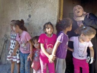 Cемья Бакр из Газы. Именно четыре мальчика из этой семьи погибли в израильской бомбардировке