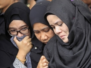 Малазийские мусульманки в трауре