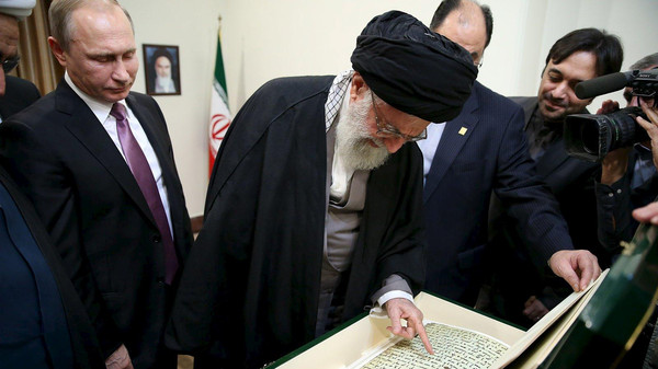 Iran's Supreme Leader Ayatollah Ali Khamenei (C) receives a gift from Russia's President Vladimir Putin (L) in Tehran November 23, 2015. REUTERS/leader.ir/Handout via ReutersATTENTION EDITORS - THIS PICTURE WAS PROVIDED BY A THIRD PARTY. REUTERS IS UNABLE TO INDEPENDENTLY VERIFY THE AUTHENTICITY, CONTENT, LOCATION OR DATE OF THIS IMAGE. EDITORIAL USE ONLY. NOT FOR SALE FOR MARKETING OR ADVERTISING CAMPAIGNS. NO RESALES. NO ARCHIVE. THIS PICTURE IS DISTRIBUTED EXACTLY AS RECEIVED BY REUTERS, AS A SERVICE TO CLIENTS.