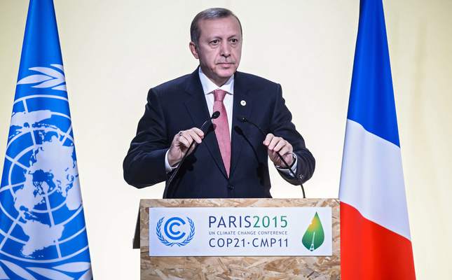 epa05049430 President of Turkey Recep Tayyip Erdogan delivers a speech as he attends Heads of States' Statements ceremony of the COP21 World Climate Change Conference 2015 in Le Bourget, north of Paris, France, 30 November 2015. The 21st Conference of the Parties (COP21) is held in Paris from 30 November to 11 December aimed at reaching an international agreement to limit greenhouse gas emissions and curtail climate change.  EPA/CHRISTOPHE PETIT TESSON